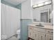 A light blue tiled bathroom with vanity and shower/tub combo at 2224 Boston Ct # A, Indianapolis, IN 46228