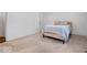 Neutral bedroom features a standard bed and light-colored carpet at 2224 Boston Ct # A, Indianapolis, IN 46228