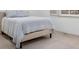 Clean bedroom with a bed and comforter, showcasing a minimalist design at 2224 Boston Ct # A, Indianapolis, IN 46228