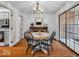 Elegant dining room with chandelier, wood table, and a large glass door to the exterior at 2224 Boston Ct # A, Indianapolis, IN 46228