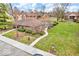 A well-maintained exterior with manicured landscaping and a charming pathway at 2224 Boston Ct # A, Indianapolis, IN 46228