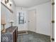 Entrance foyer featuring slate tile floor, decorated table, and door with decorative window at 2224 Boston Ct # A, Indianapolis, IN 46228