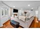 Bright and open living area with fireplace, hardwood floors and abundant natural light at 2224 Boston Ct # A, Indianapolis, IN 46228