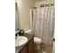 Full bathroom with shower stall, wood vanity, and beach-themed decor at 2322 Bainbridge Rd, Greenwood, IN 46143