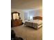 Main bedroom with dresser, a comfortable bed, and neutral colors at 2322 Bainbridge Rd, Greenwood, IN 46143