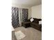 Relaxing living room with sectional sofa and patterned curtains at 2322 Bainbridge Rd, Greenwood, IN 46143