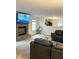 Spacious living room features a brick fireplace, comfortable seating, and open view to the adjacent kitchen area at 2322 Bainbridge Rd, Greenwood, IN 46143