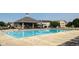 Community pool with lounge chairs and shaded seating area at 2322 Bainbridge Rd, Greenwood, IN 46143