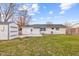 View of the backyard with a shed, patio, and well-maintained lawn at 2615 12Th St, Columbus, IN 47201