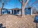 Backyard view, featuring a covered patio and mature trees at 2814 S Randolph St, Indianapolis, IN 46203