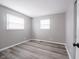 Bedroom with neutral paint and flooring with two windows and closet at 2814 S Randolph St, Indianapolis, IN 46203