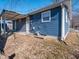 Blue house exterior with covered patio and detached garage at 2814 S Randolph St, Indianapolis, IN 46203