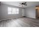 Bright living room with a ceiling fan, gray walls, and hardwood floors at 2814 S Randolph St, Indianapolis, IN 46203