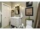 Cozy bathroom featuring a stylish vanity, neutral paint, and modern lighting at 301 Lowry St, Jamestown, IN 46147