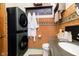 Cozy bathroom with an updated washer/dryer with granite countertops and a unique backsplash at 301 Lowry St, Jamestown, IN 46147