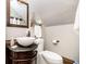 Well-lit bathroom with a vessel sink, dark wood vanity, and modern fixtures at 301 Lowry St, Jamestown, IN 46147