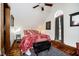 Bright bedroom with a ceiling fan, wood floors, and a window allowing natural light at 301 Lowry St, Jamestown, IN 46147