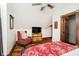 Cozy bedroom with a sloped ceiling, wood floors, and comfortable furnishings at 301 Lowry St, Jamestown, IN 46147