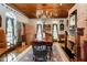 Charming dining room with wood floors, coffered ceiling, and a unique chandelier at 301 Lowry St, Jamestown, IN 46147