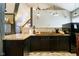 Kitchen with granite counter tops and stainless steel appliances with plenty of cabinet space with unique lighting at 301 Lowry St, Jamestown, IN 46147