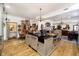 Open-concept kitchen with a large island featuring a sink, offering a seamless flow to other living areas at 301 Lowry St, Jamestown, IN 46147