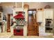 Well appointed kitchen with stainless steel appliances, granite countertops, custom cabinets, and custom backsplash at 301 Lowry St, Jamestown, IN 46147