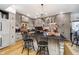 Elegant kitchen featuring gray cabinets, hardwood floors, a brick backsplash, and a center island at 301 Lowry St, Jamestown, IN 46147