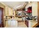 Bright kitchen with stainless steel appliances, custom cabinets, and a skylight providing plenty of natural light at 301 Lowry St, Jamestown, IN 46147