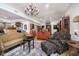 Spacious living room showcasing hardwood floors, antique furniture, and decorative accents at 301 Lowry St, Jamestown, IN 46147