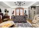 Cozy living room boasting a decorative sofa, hardwood floors, a chandelier, and elegant furniture at 301 Lowry St, Jamestown, IN 46147