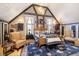 Cozy main bedroom with a four-poster bed, exposed beams, and rustic accents at 301 Lowry St, Jamestown, IN 46147