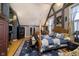 Spacious main bedroom with a four-poster bed, hardwood floors, and decorative beams at 301 Lowry St, Jamestown, IN 46147