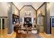 Stylish home office with vaulted ceilings and wooden beams, lots of storage, and a unique antique design at 301 Lowry St, Jamestown, IN 46147