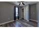 Bedroom with gray walls, wood-look floors and closet at 308 E 54Th St, Anderson, IN 46013