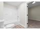 Updated bathroom with a shower/tub combo and neutral color scheme at 317 N Belleview Pl, Indianapolis, IN 46222