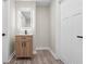 Modern bathroom with light wood vanity, updated fixtures, and neutral colors at 317 N Belleview Pl, Indianapolis, IN 46222