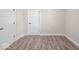 Spacious bedroom with neutral walls and wood-look flooring at 317 N Belleview Pl, Indianapolis, IN 46222