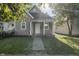 Updated bungalow with a front porch and a sunny front yard at 317 N Belleview Pl, Indianapolis, IN 46222