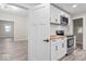 Renovated kitchen boasting white cabinets, butcher block counters, and stainless steel appliances at 317 N Belleview Pl, Indianapolis, IN 46222