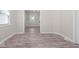 Open and bright living area with neutral walls and wood-look flooring at 317 N Belleview Pl, Indianapolis, IN 46222