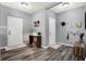 Bright entryway with gray walls, wood-look floors, and storage at 3174 Hemlock St, Whiteland, IN 46184