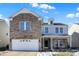 Two-story brick home with a white garage door and landscaping at 3174 Hemlock St, Whiteland, IN 46184