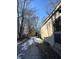 Long side yard with shed and snow covered ground at 3512 N Keystone Ave, Indianapolis, IN 46218