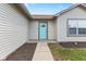 Inviting front door with light teal color and walkway at , Indianapolis, IN 46235