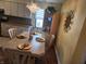 Bright dining area with a table set for four and built-in cabinetry at 4371 Abby Creek Ln, Indianapolis, IN 46205