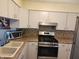 Kitchen features stainless steel appliances and tile backsplash at 4371 Abby Creek Ln, Indianapolis, IN 46205