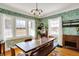 Bright dining room features modern light fixture and large windows for natural light at 5210 E Pleasant Run Parkway North Dr, Indianapolis, IN 46219