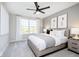 Bright bedroom with large window, plush bed, and modern nightstands at 5326 Noble Crossing W Pkwy, Noblesville, IN 46062