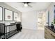 Bedroom featuring a crib, dresser, and animal wall art at 5326 Noble Crossing W Pkwy, Noblesville, IN 46062