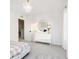 Well-lit bedroom with white dresser and gingham bedding at 5326 Noble Crossing W Pkwy, Noblesville, IN 46062
